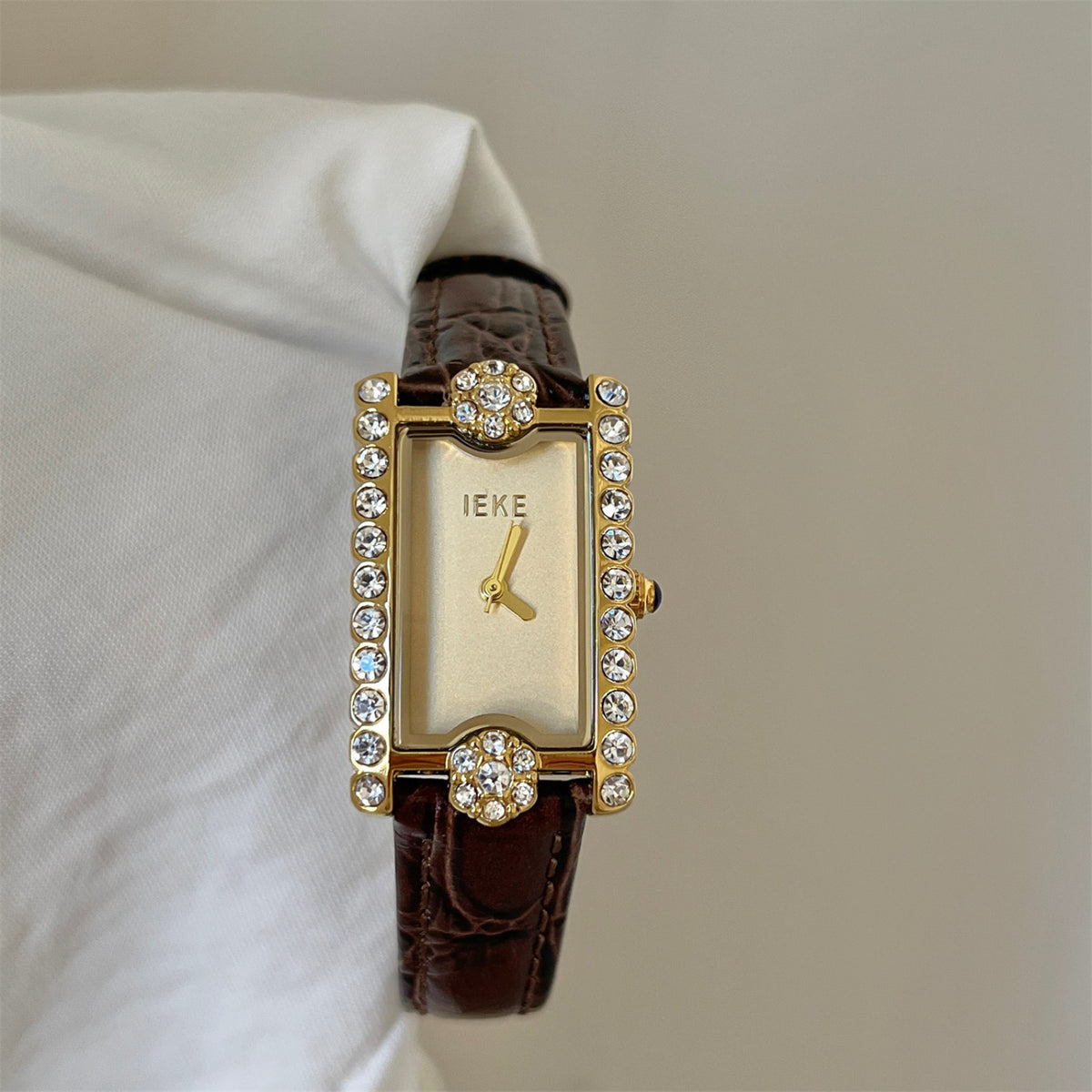 IEKE women's rectangular crystal watch with champagne dial, gold-tone case and brown crocodile-embossed strap