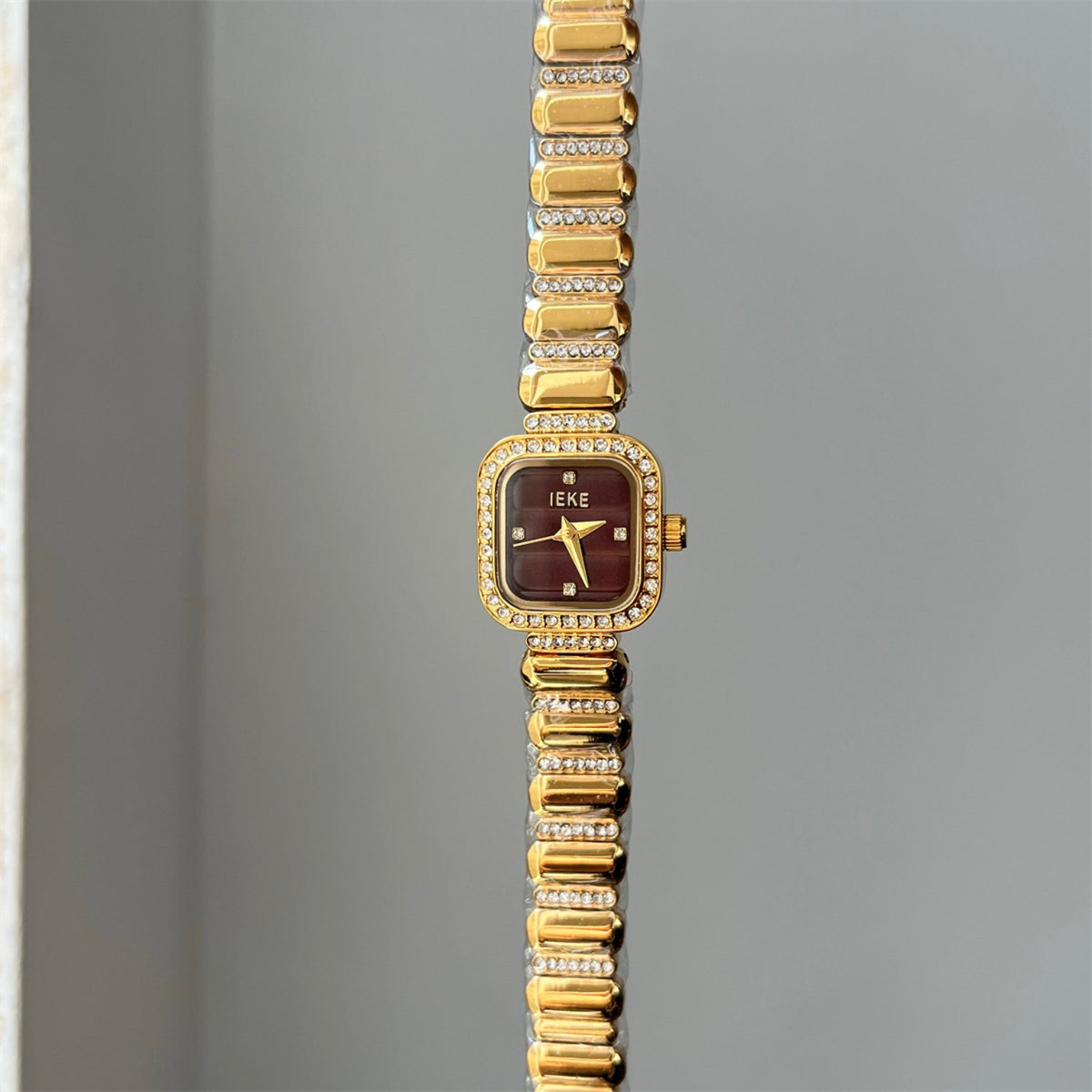 IEKE women's crystal square bracelet watch in gold with burgundy dial
