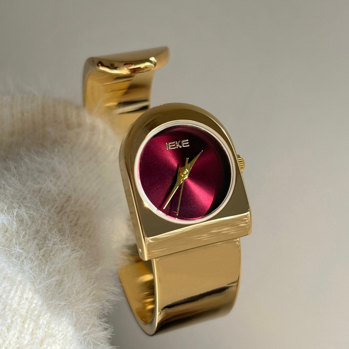 IEKE cuff bracelet watch with burgundy dial