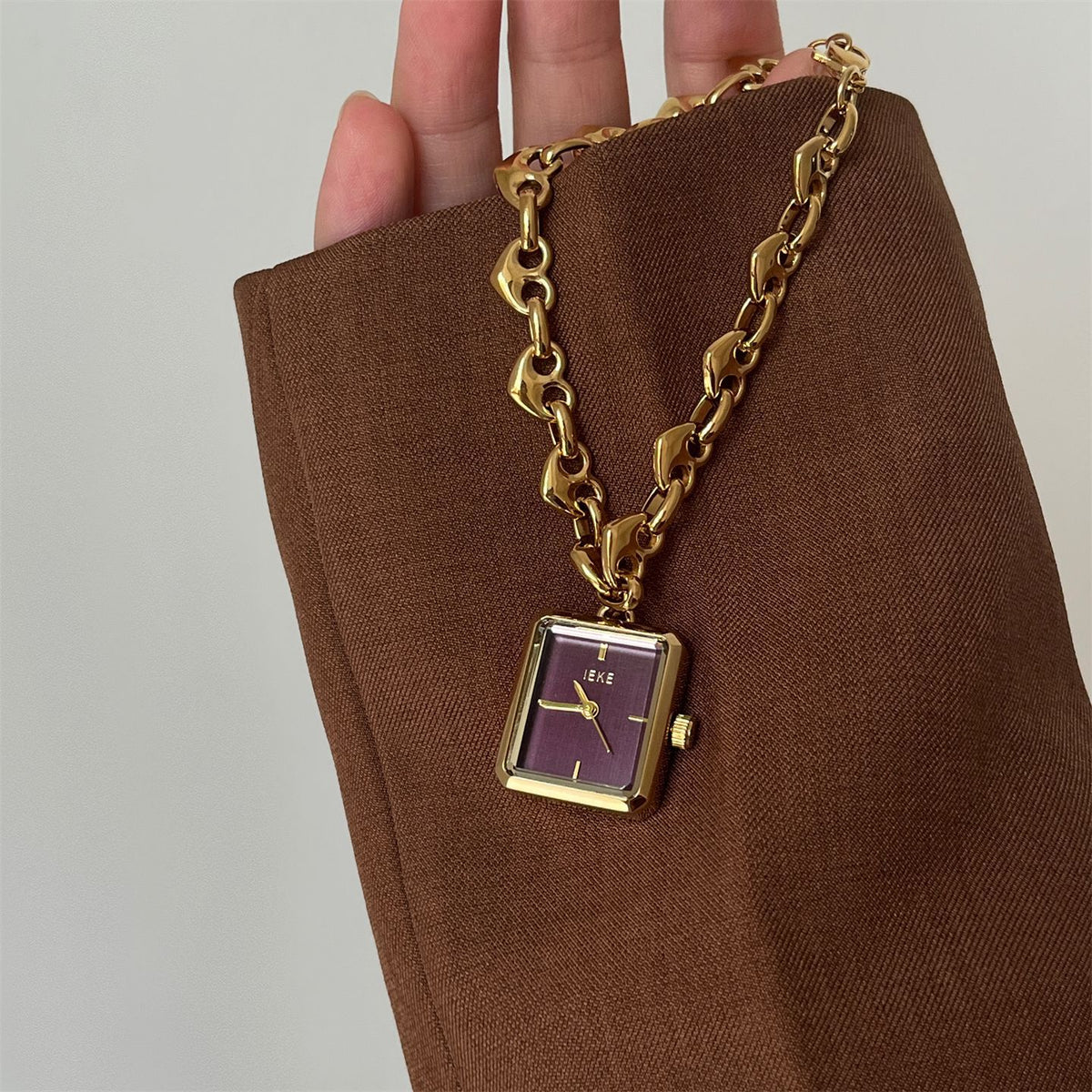IEKE petite square heart-link bracelet watch with gold-tone bracelet and plum dial
