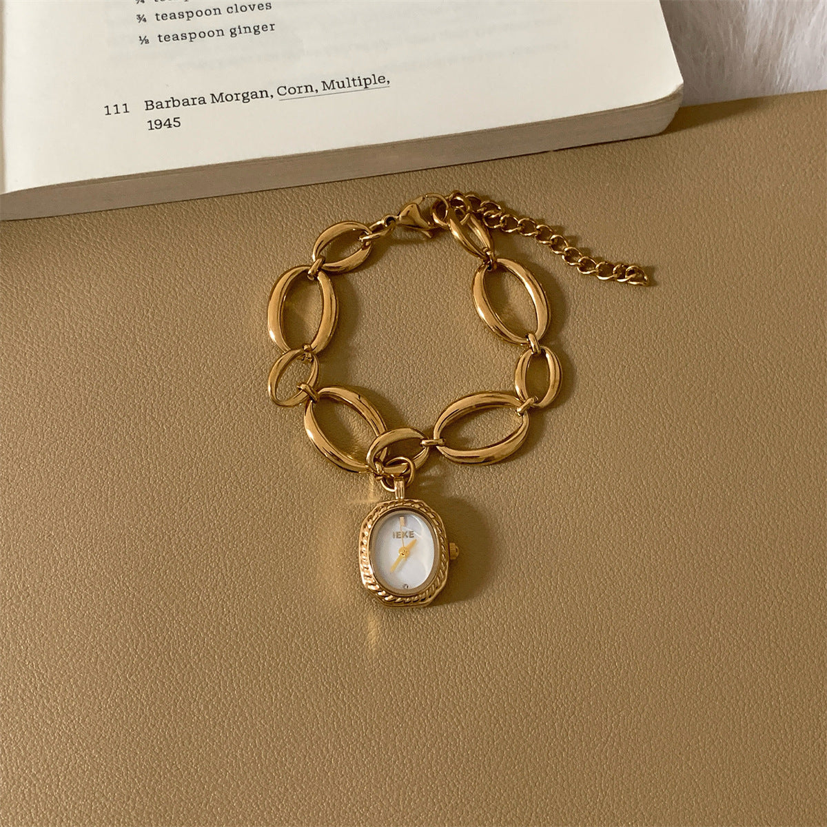 IEKE gold-tone oval-link bracelet watch with white dial