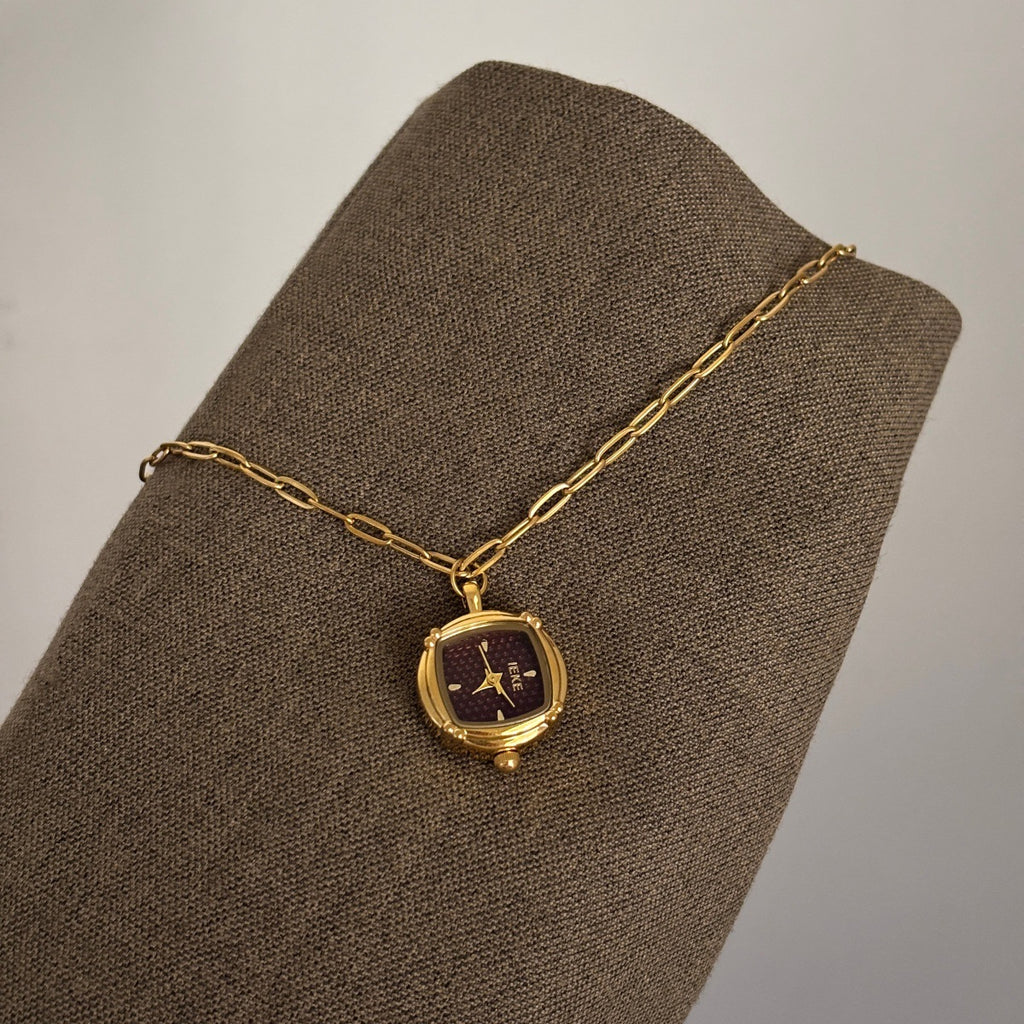 IEKE gold-tone pendant watch with burgundy dial