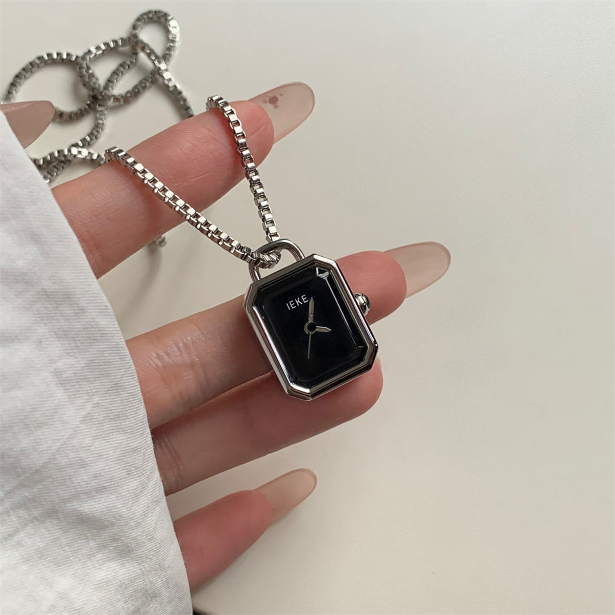 IEKE silver rectangular pendant necklace watch with black dial