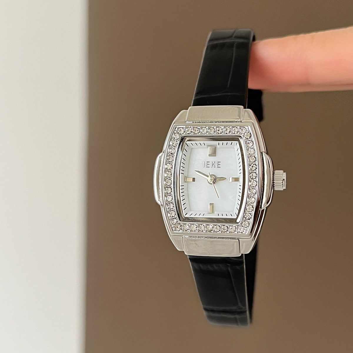 IEKE petite crystal tonneau watch with black leather-look strap, silver-tone case and white dial