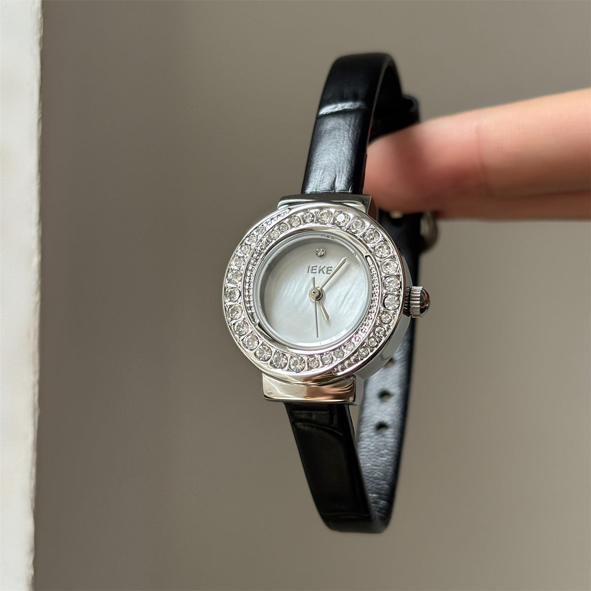 IEKE petite round crystal watch with black strap, silver-tone case and white dial