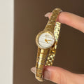 IEKE women's petite round quartz watch in gold tone with white dial and expansion bracelet