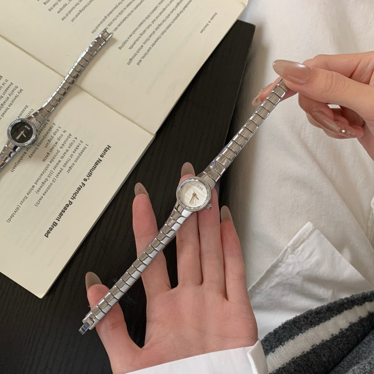 IEKE women's petite round silver-tone quartz watch with white dial and polished expansion bracelet