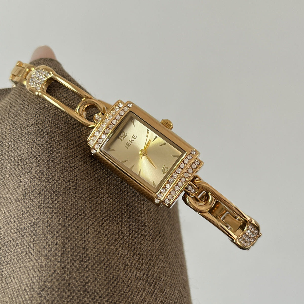 IEKE gold-tone pin-link bracelet watch with champagne dial