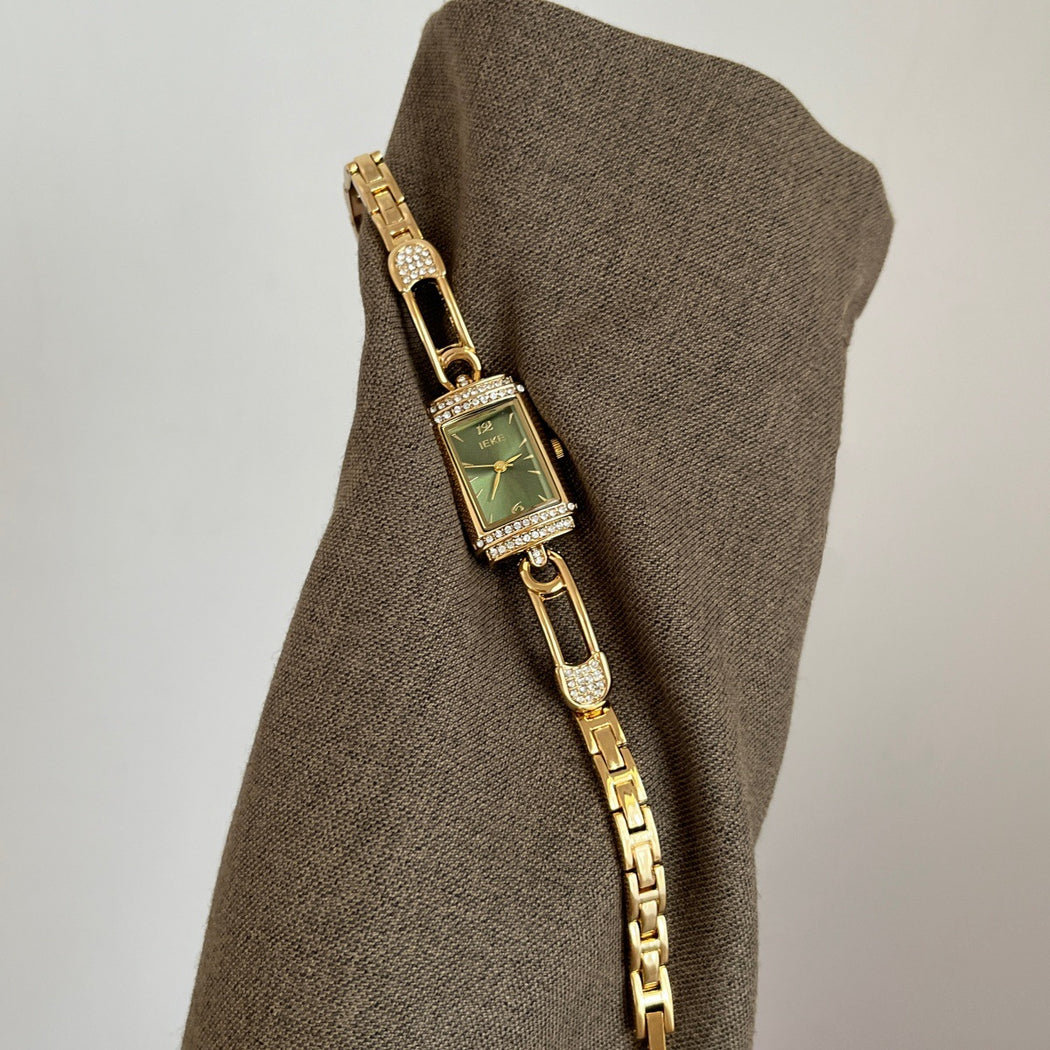 IEKE gold-tone pin-link bracelet watch with green dial