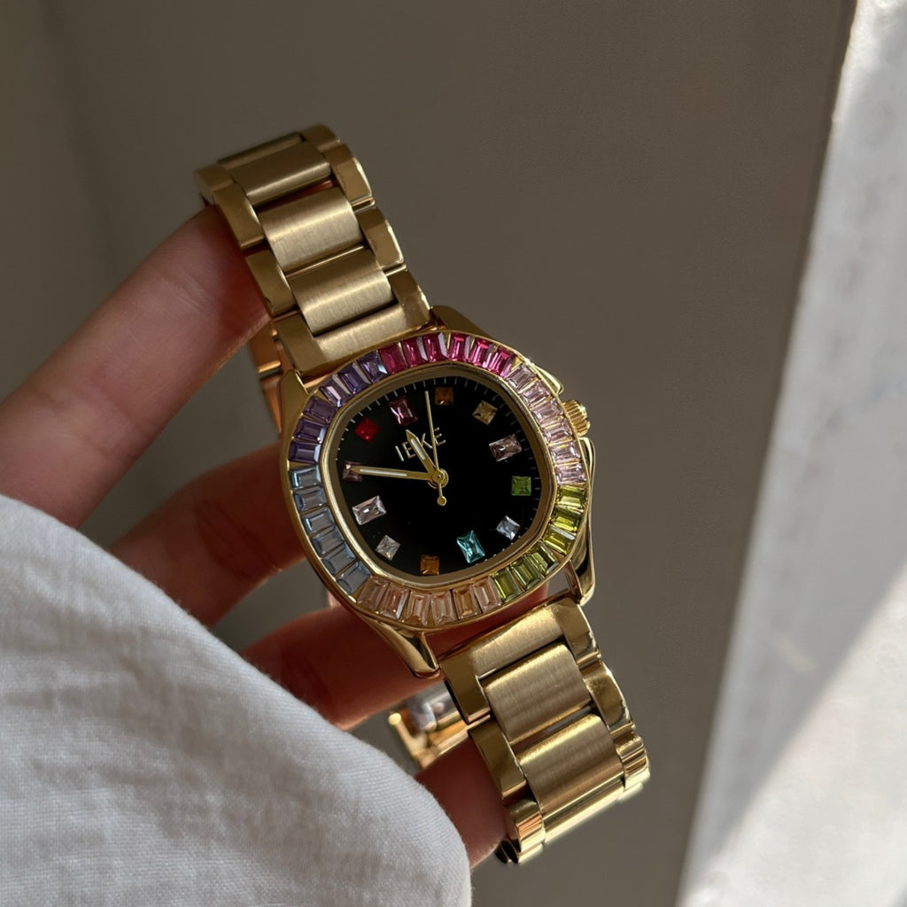 IEKE women's rainbow crystal bracelet watch with gold-tone bracelet and black dial