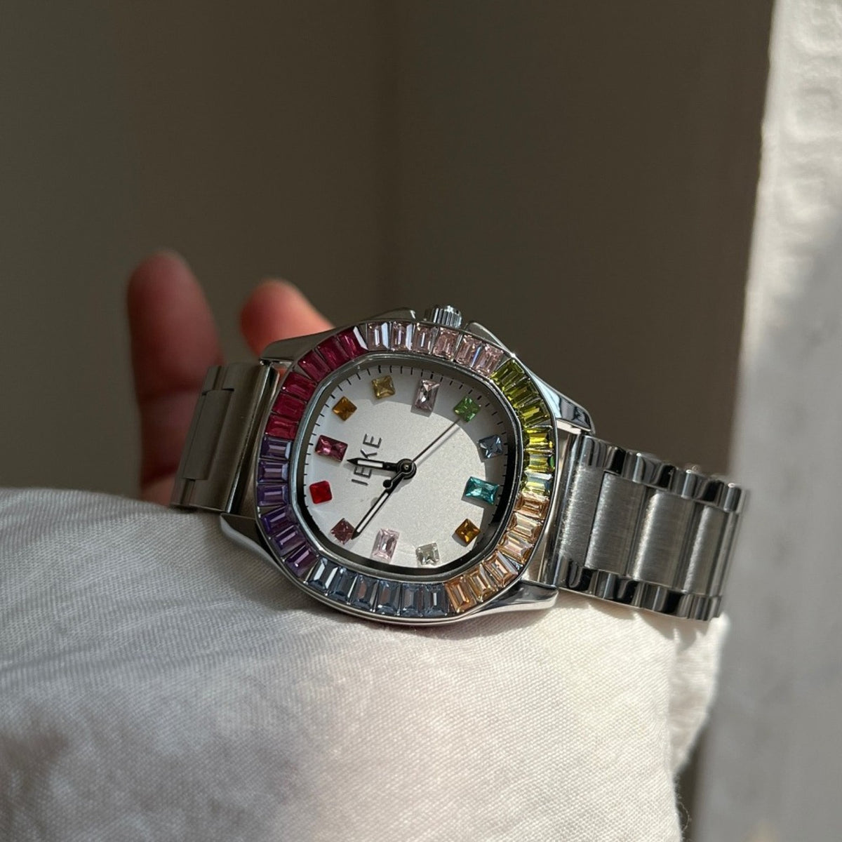 IEKE women's rainbow crystal bracelet watch with silver-tone bracelet and white dial
