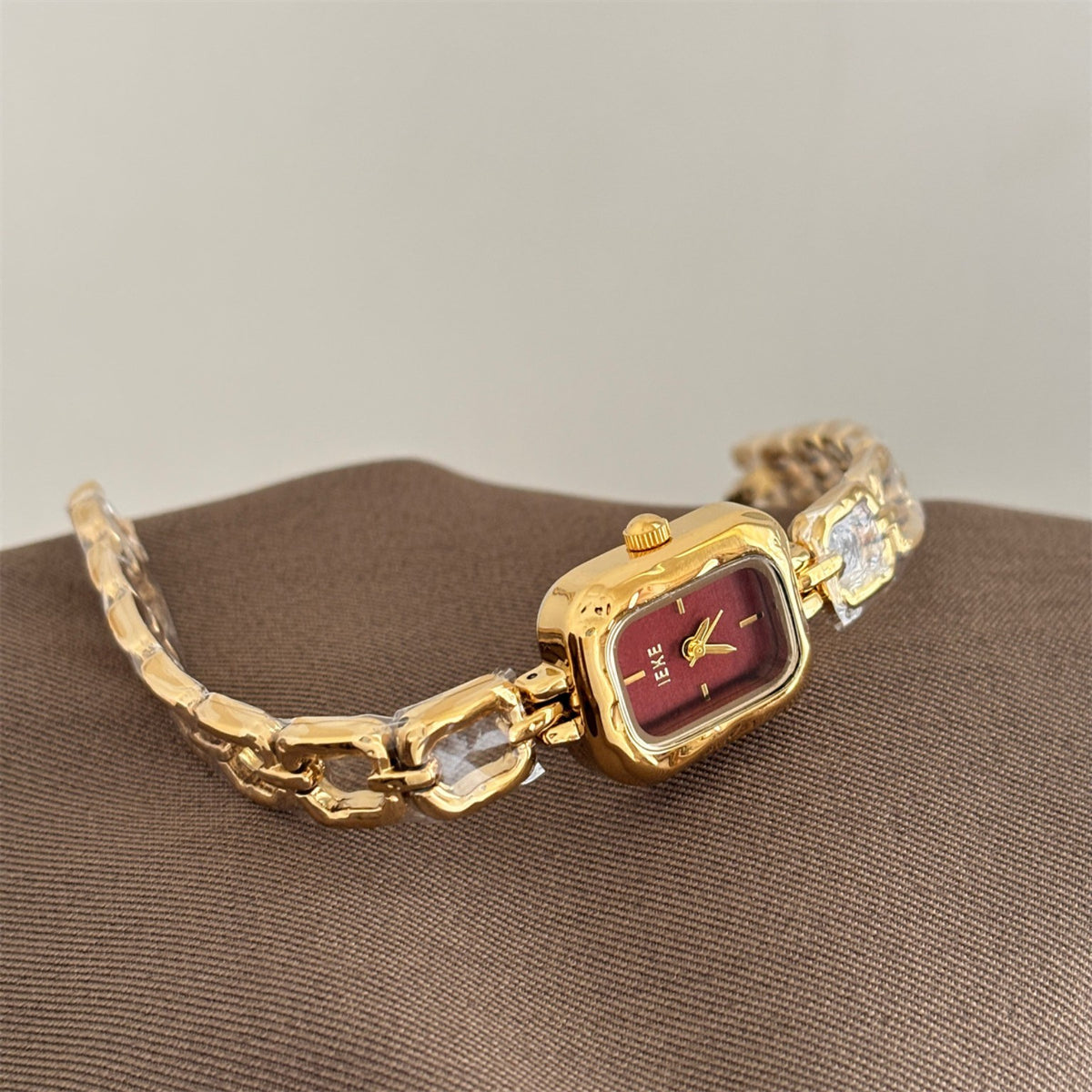 IEKE women's sculpted link square bracelet watch in gold with burgundy dial