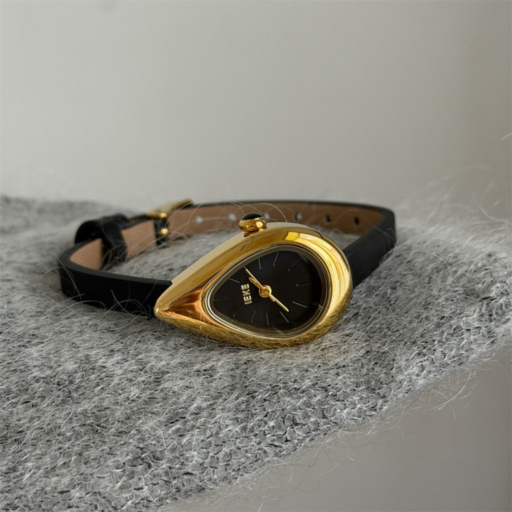IEKE sculptural teardrop women's quartz watch with black dial, black strap and gold-tone case