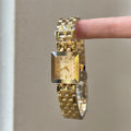 IEKE petite square bracelet watch in gold tone with champagne dial