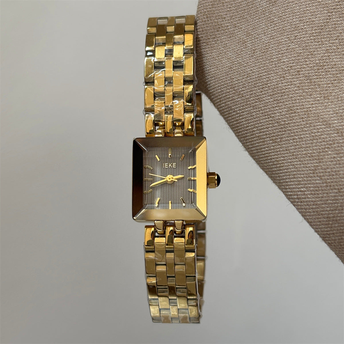 IEKE petite square bracelet watch in gold tone with grey dial