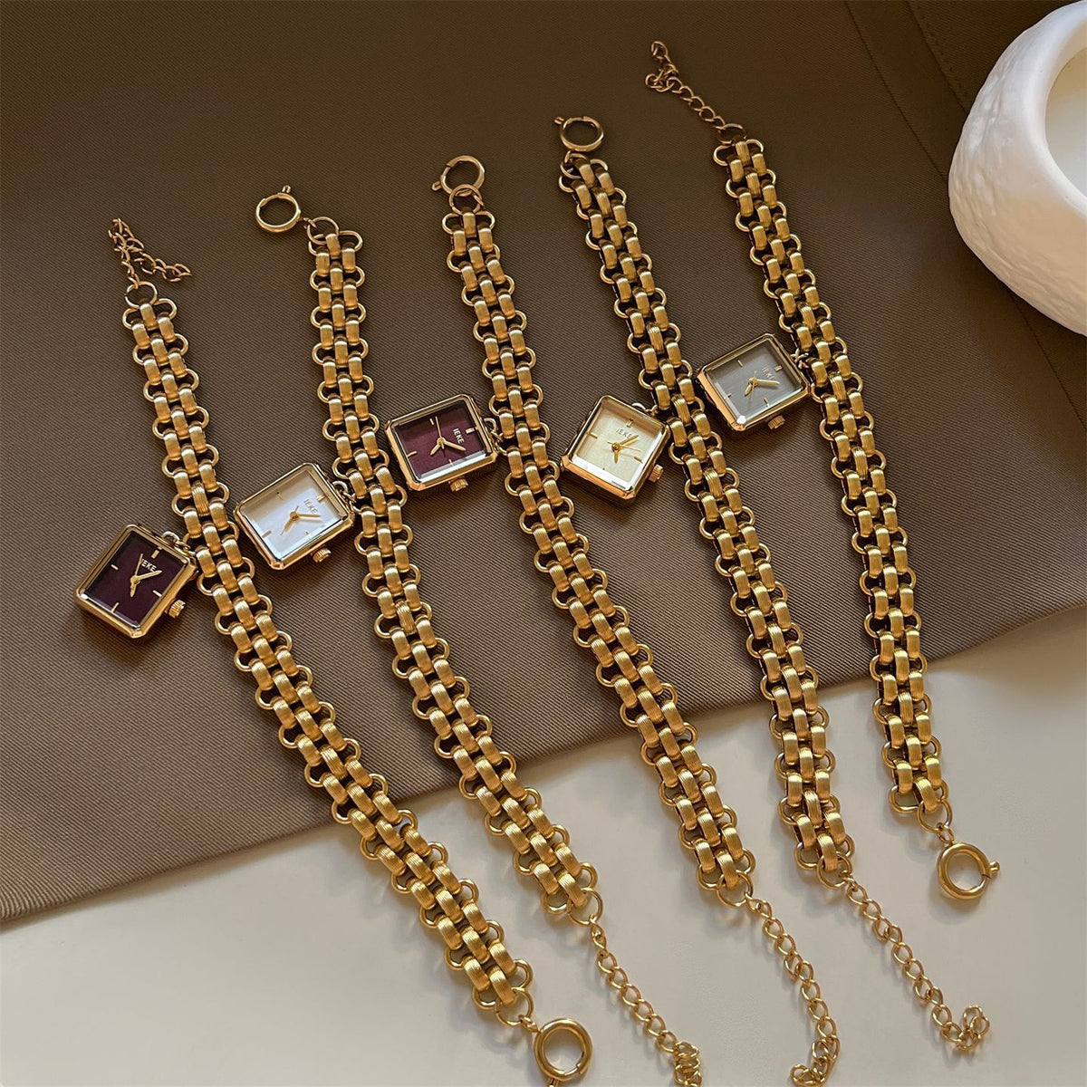 IEKE square chain bracelet watch collection with gold-tone metal straps and multiple dial colors