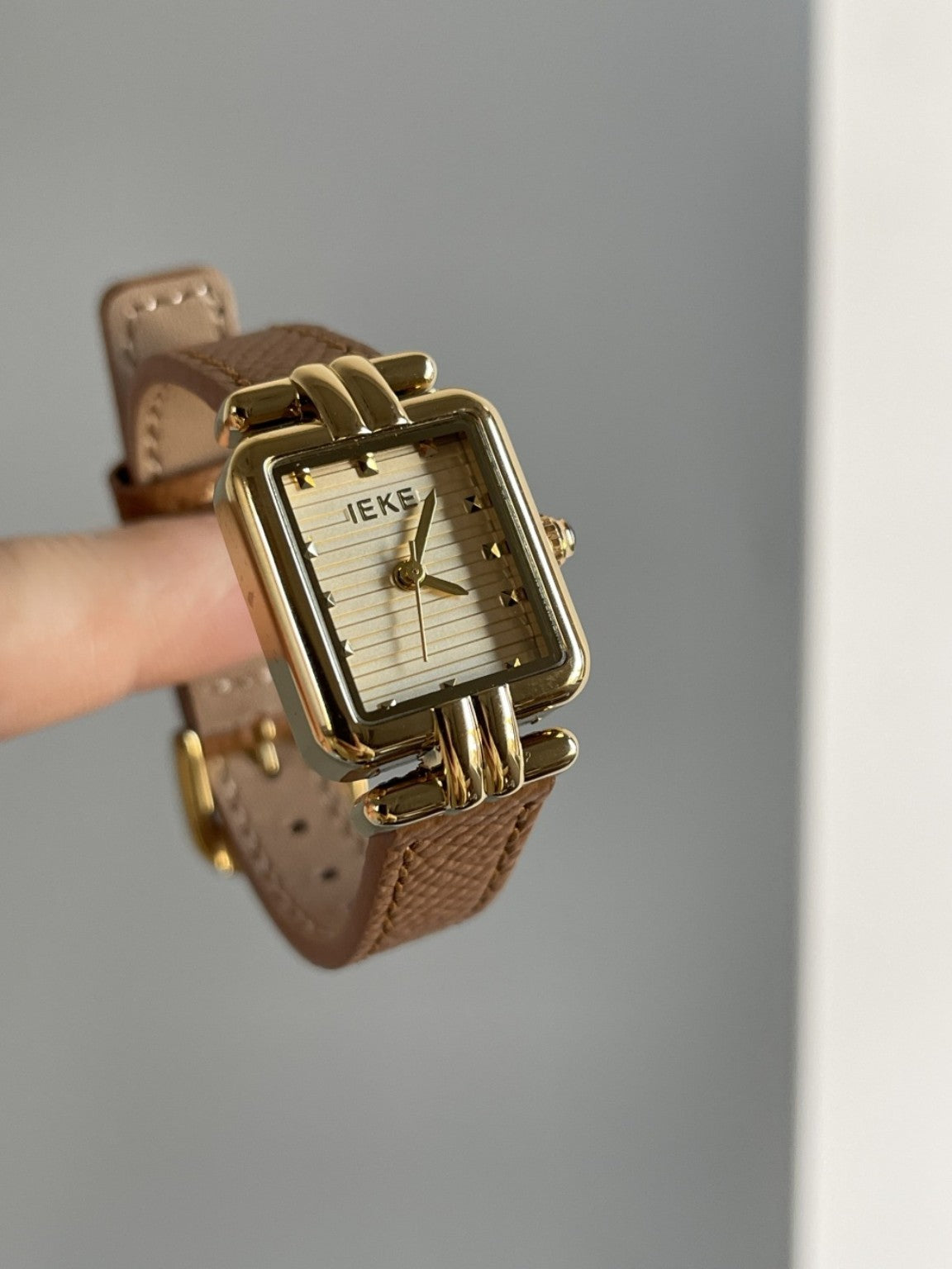 IEKE square Art Deco style women's watch with gold-tone case and brown strap