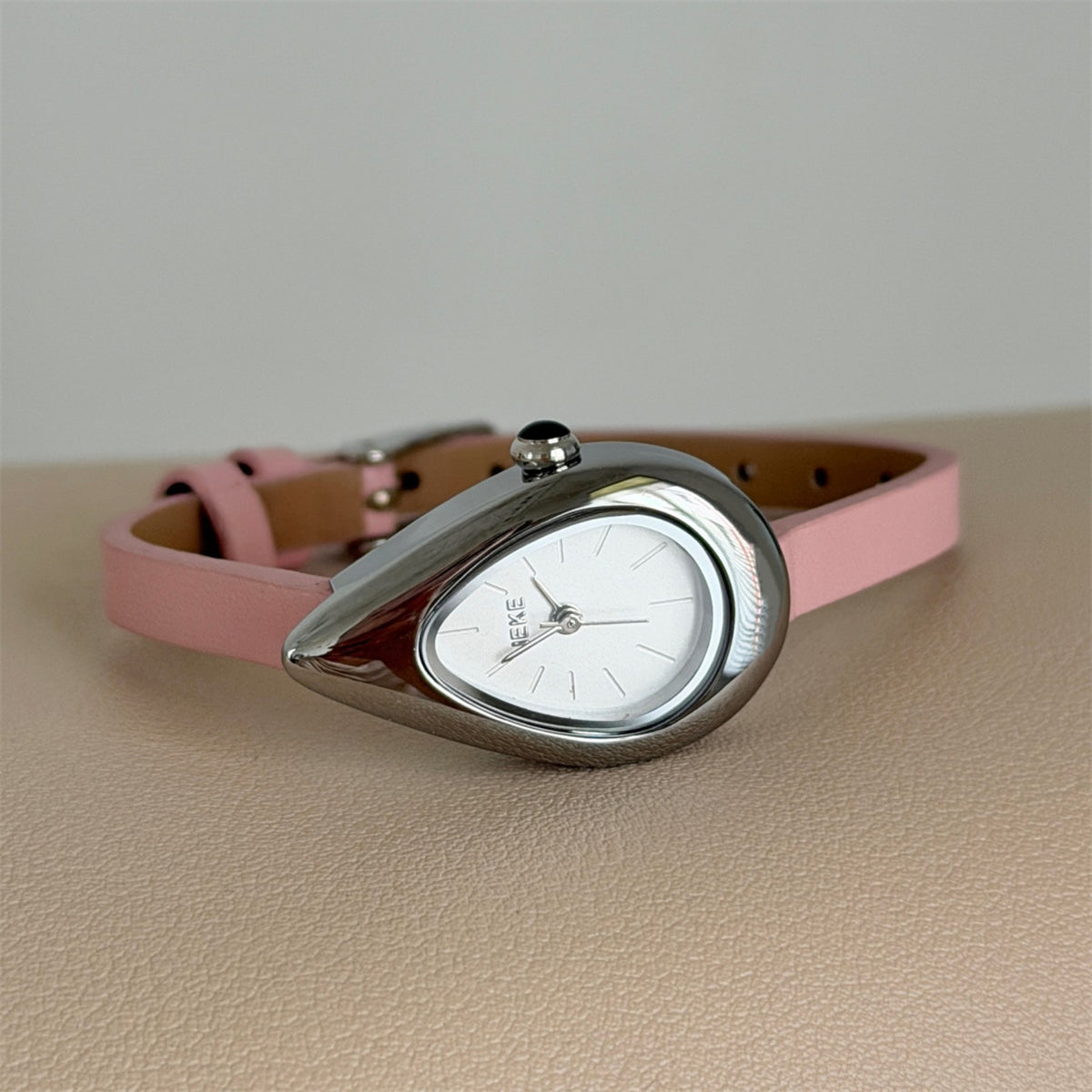 IEKE teardrop women's quartz watch with white dial, pink strap and silver-tone case