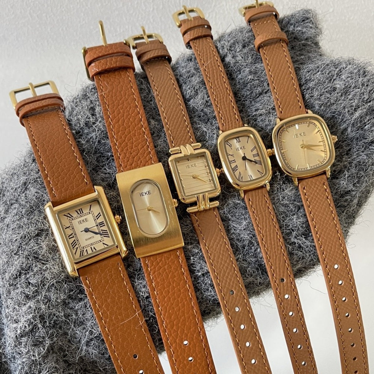 IEKE women's vintage brown strap watch collection with five gold-tone dial styles