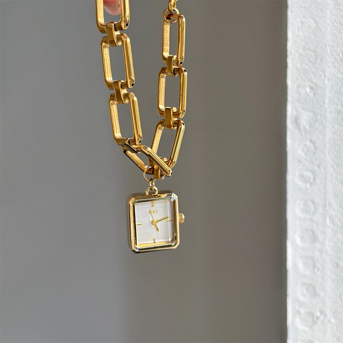 IEKE vintage charm bracelet watch with gold-tone open-link bracelet and white dial