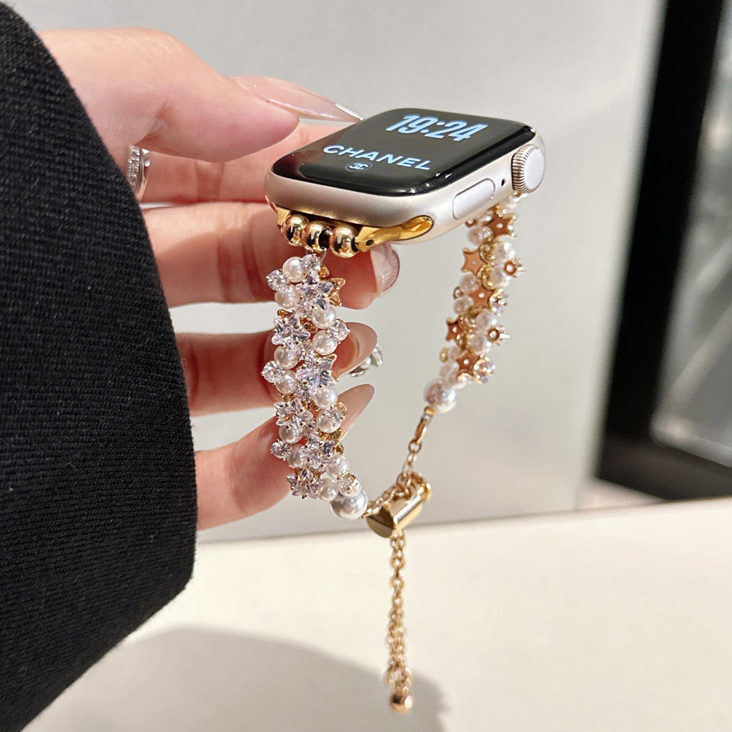 Silver and gold pearl crystal Apple Watch bands shown together