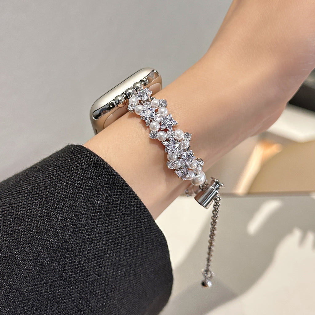 Silver tone pearl and crystal Apple Watch bracelet band worn on wrist