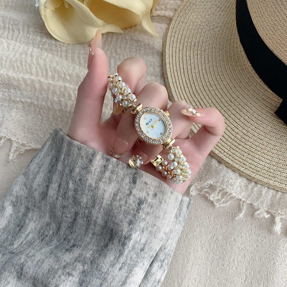 ISLY pearl crystal-style oval bracelet watch in gold tone