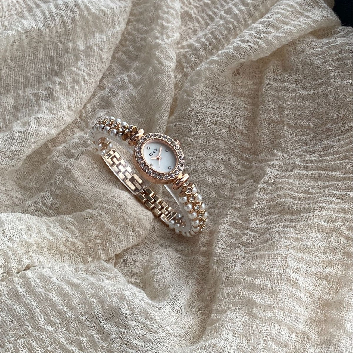 ISLY pearl crystal-style oval bracelet watch in rose gold tone