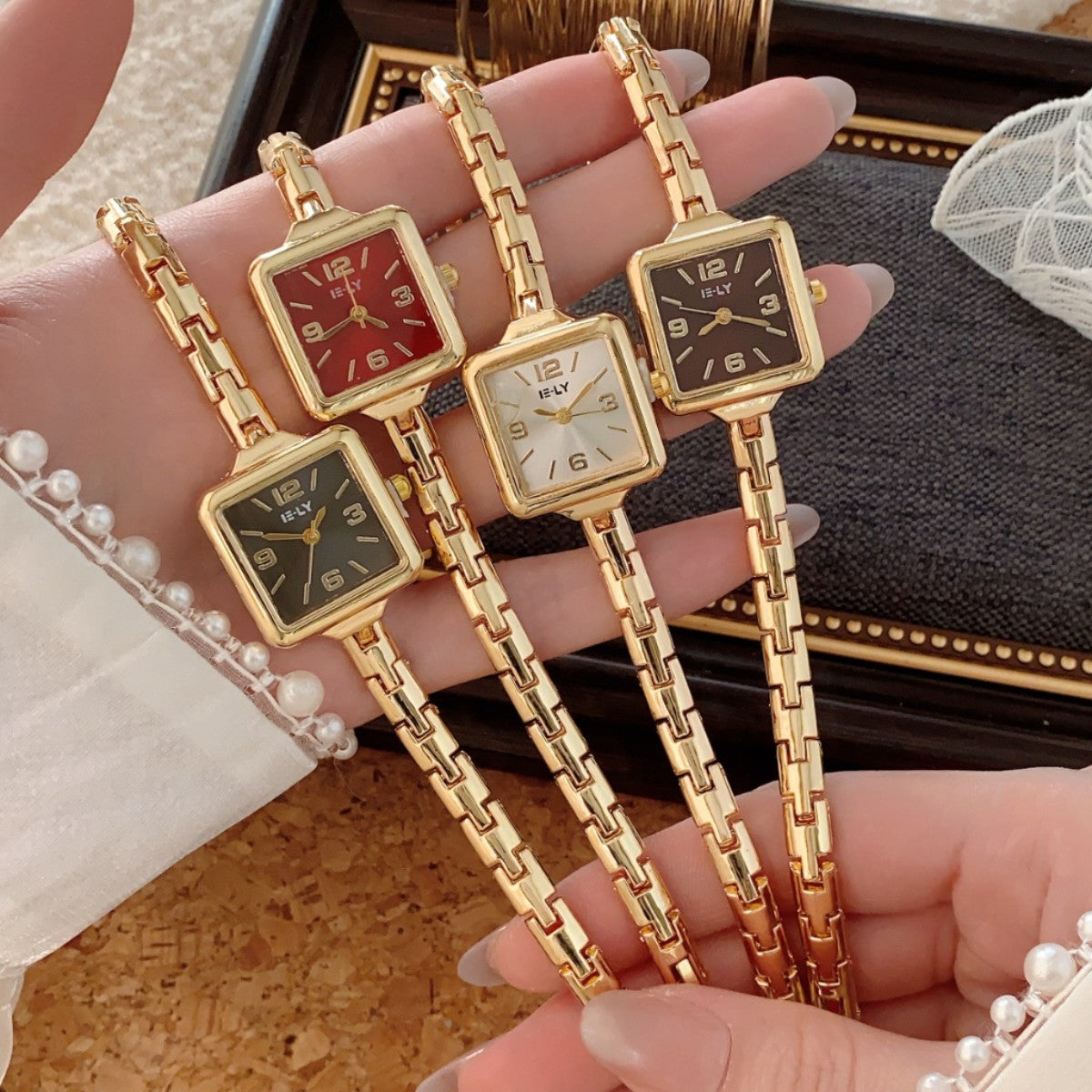 ISLY square bracelet watches in gold tone with multiple dial colors