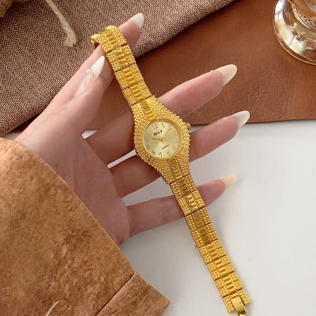 ISLY textured gold-tone stainless steel bracelet watch with champagne dial full view
