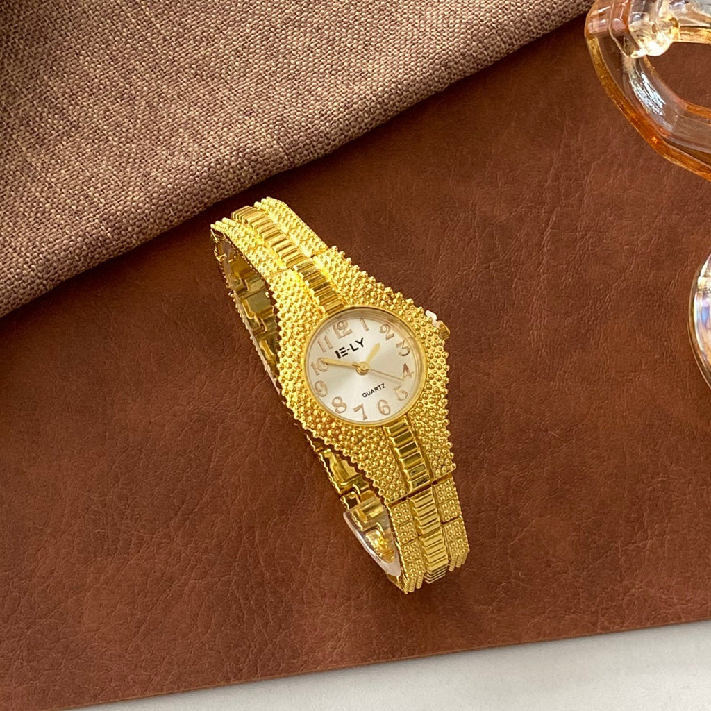 ISLY textured gold-tone stainless steel bracelet watch with ivory dial angled view