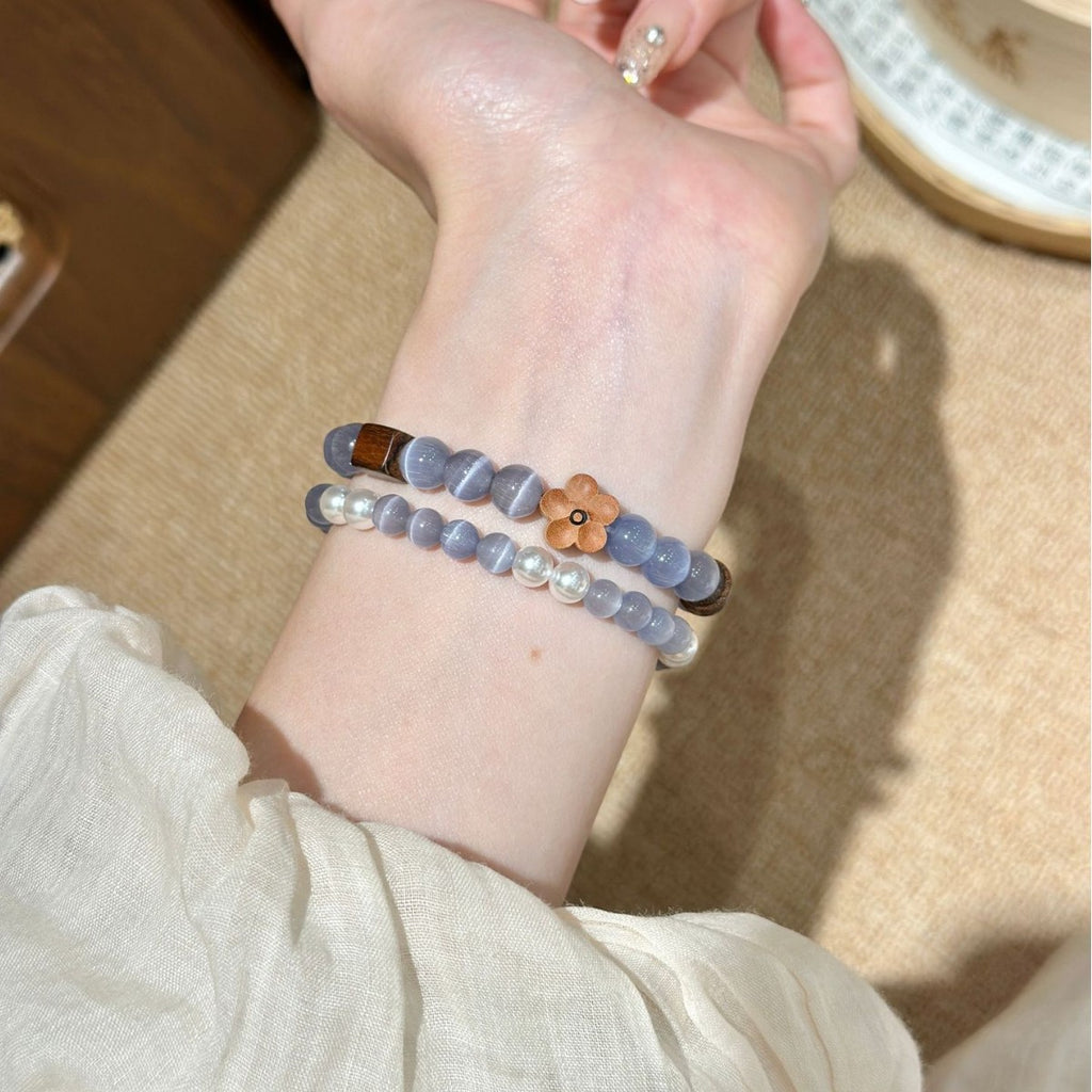 Mist grey beaded bracelet band with flower and pearl accents