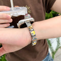 Colourful stainless steel modular charm smartwatch band worn on wrist