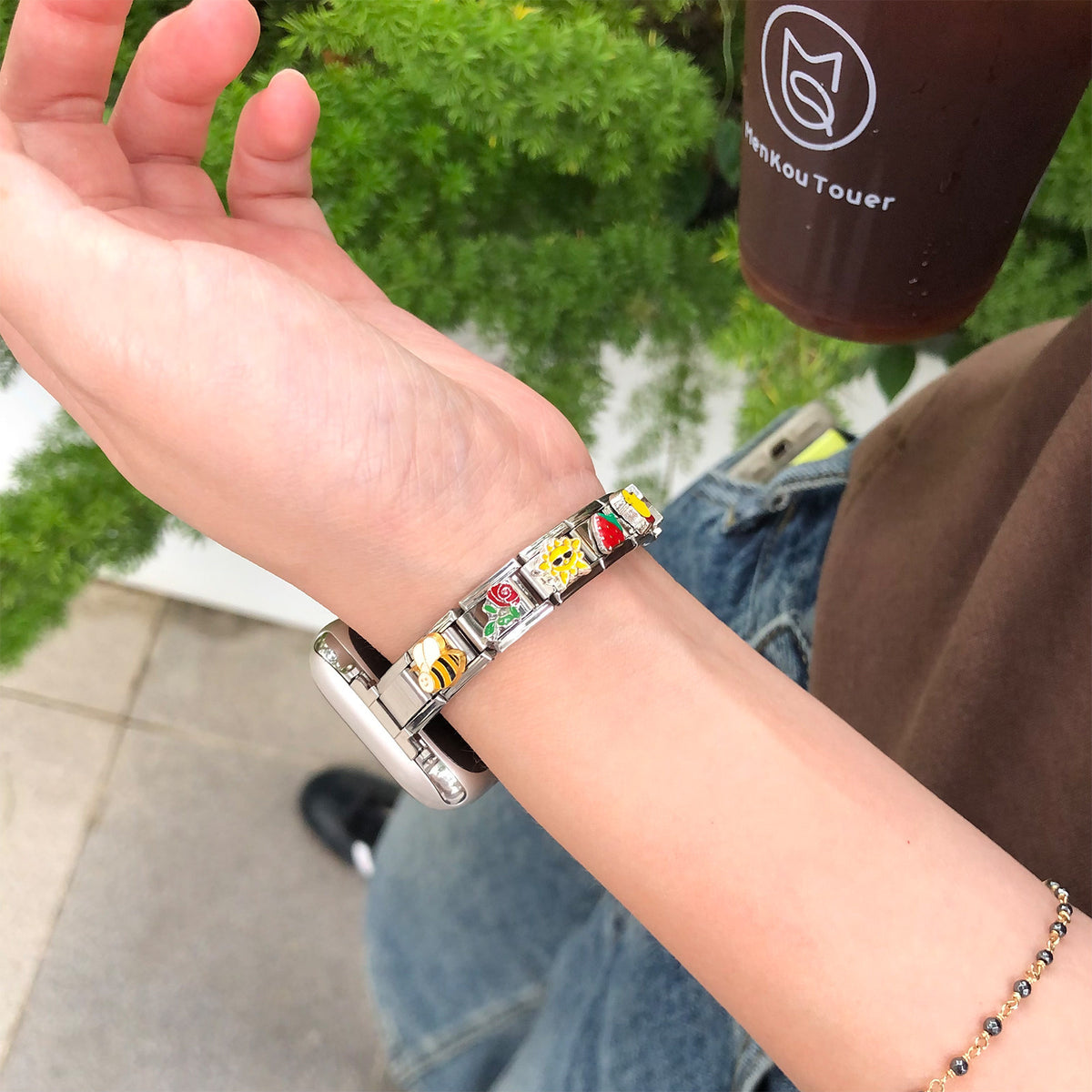 Stainless steel modular charm smartwatch bracelet band worn outdoors
