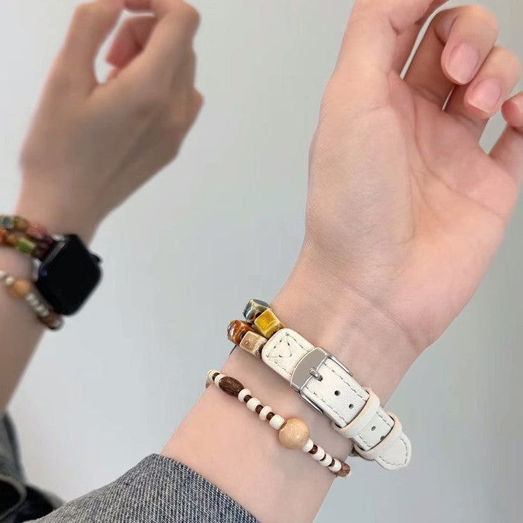 Ivory mosaic bead leather Apple Watch band worn on wrist