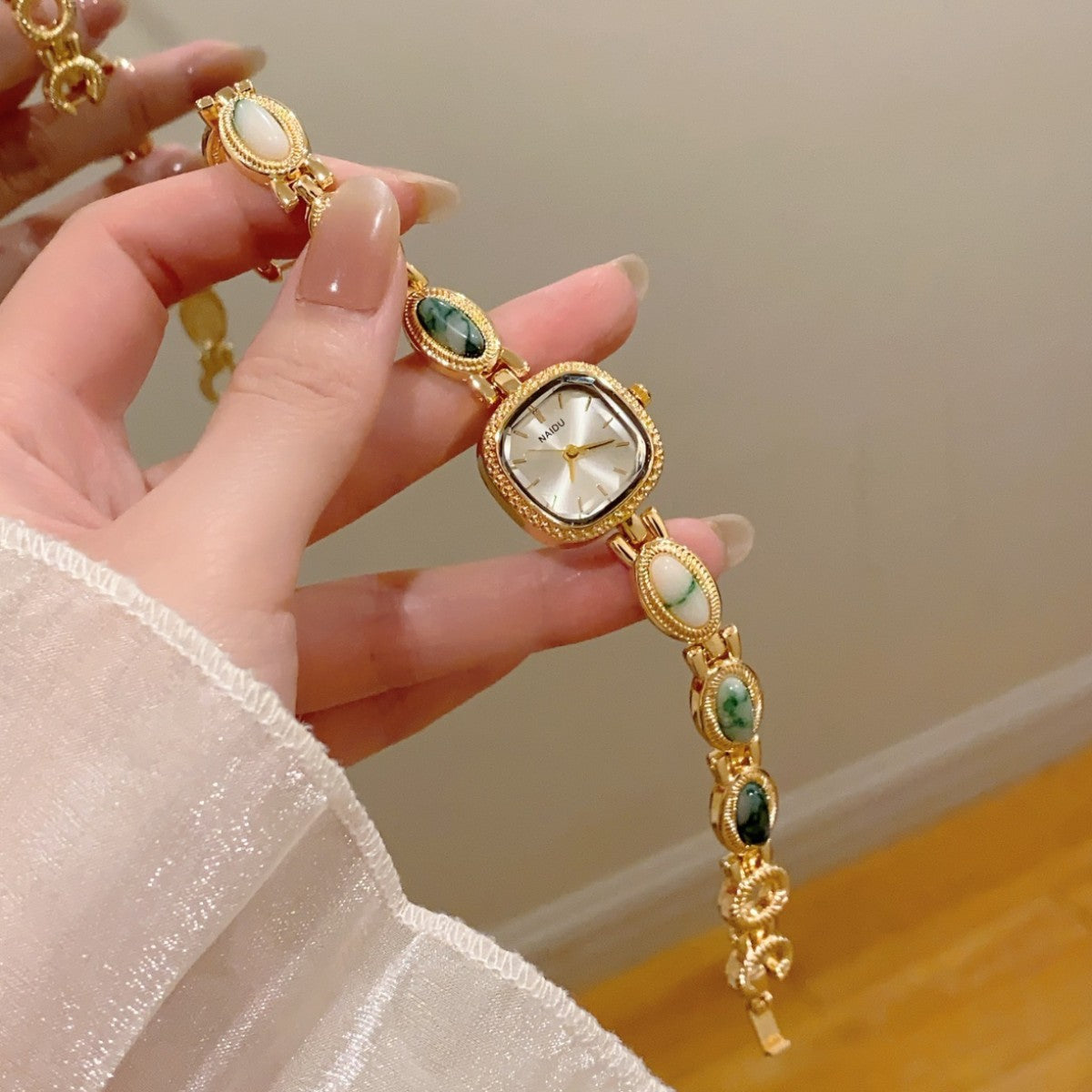 NAIDU cabochon-style jewelry watch with green marble accents