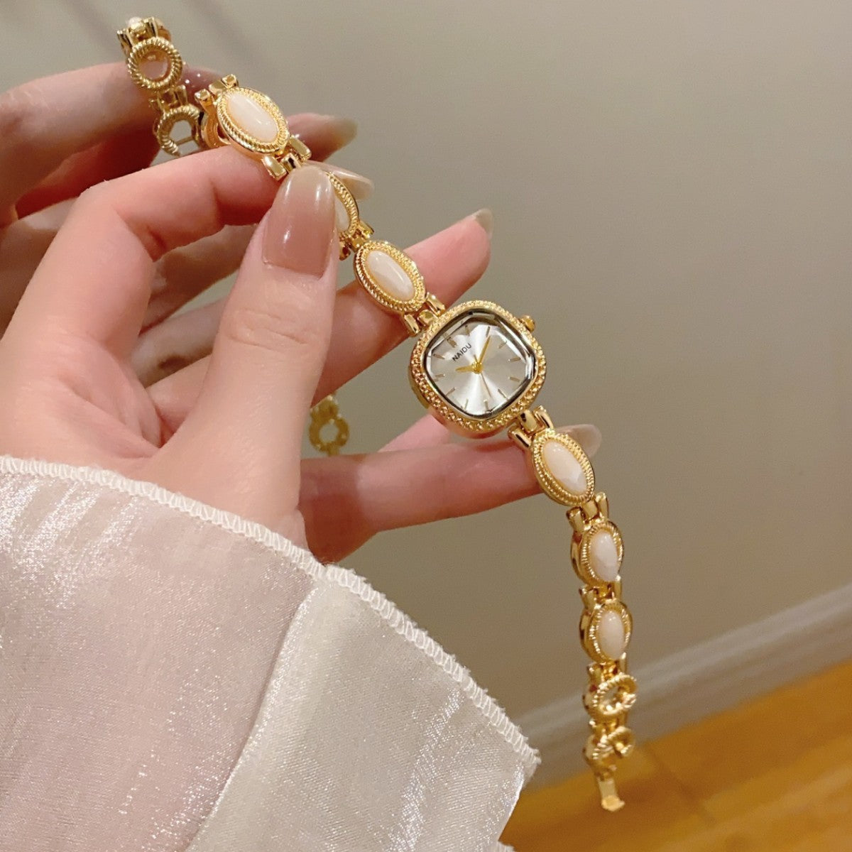 NAIDU cabochon-style jewelry watch with ivory accents