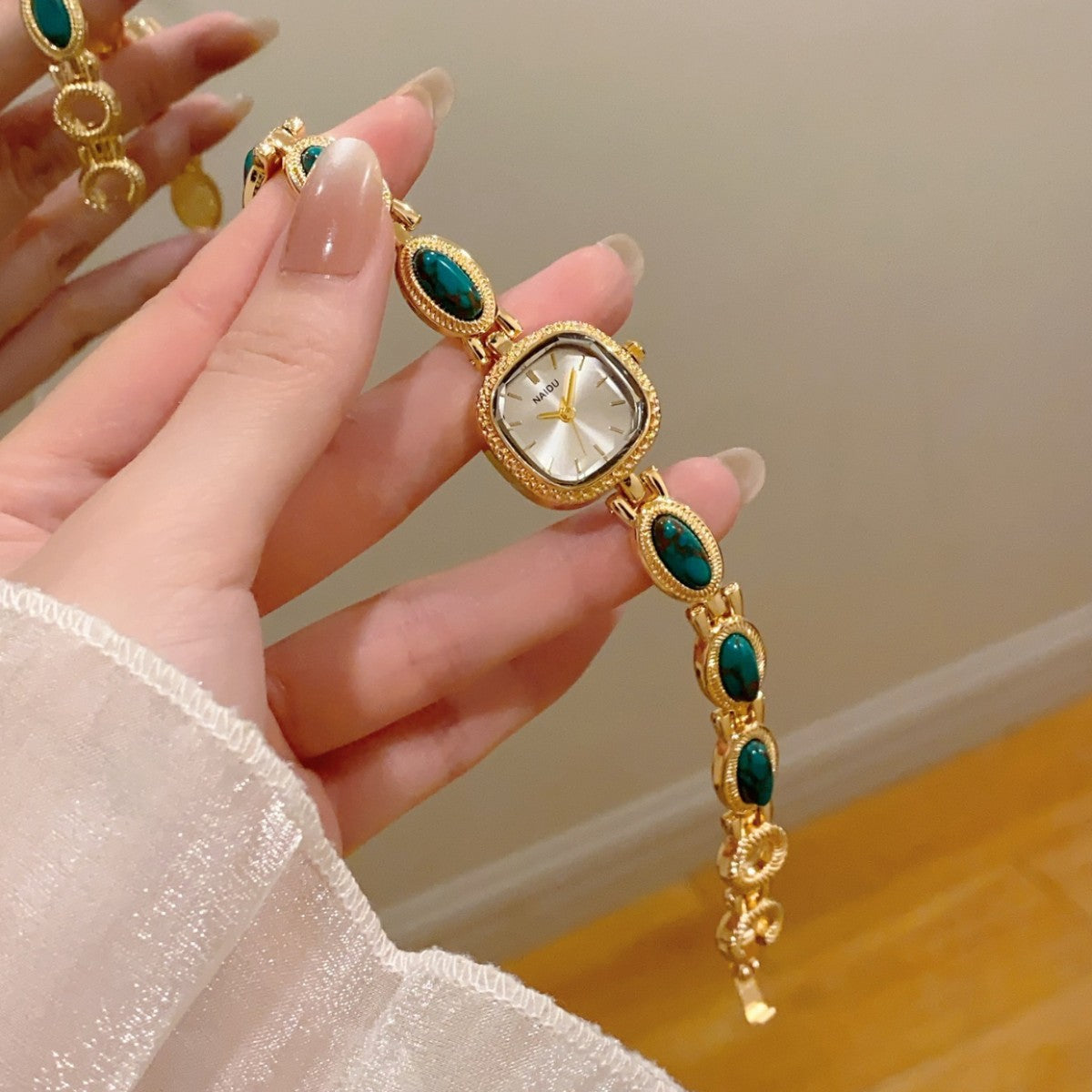 NAIDU cabochon-style jewelry watch with turquoise accents
