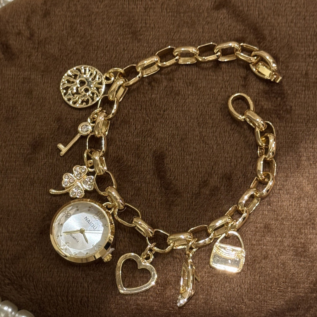NAIDU charm bracelet watch in gold tone with white dial