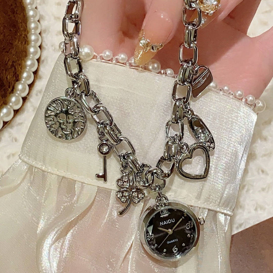 NAIDU charm bracelet watch in silver tone with black dial hand view