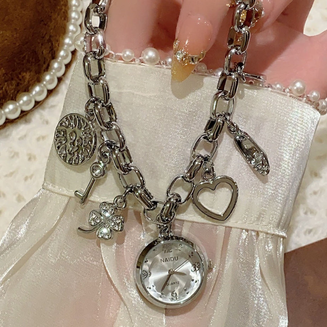 NAIDU charm bracelet watch in silver tone with white dial hand view