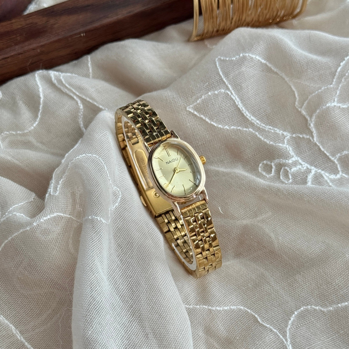 NAIDU vintage gold-tone steel bracelet quartz watch with champagne dial