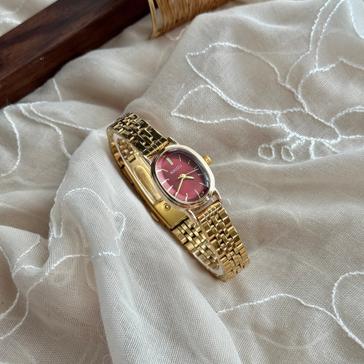 NAIDU vintage gold-tone steel bracelet quartz watch with red dial
