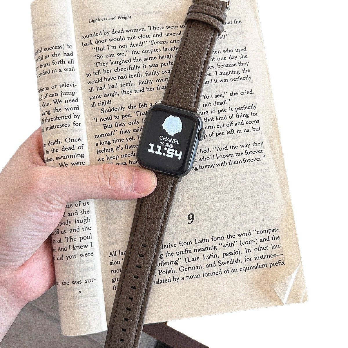 Pebbled leather smartwatch strap worn on wrist