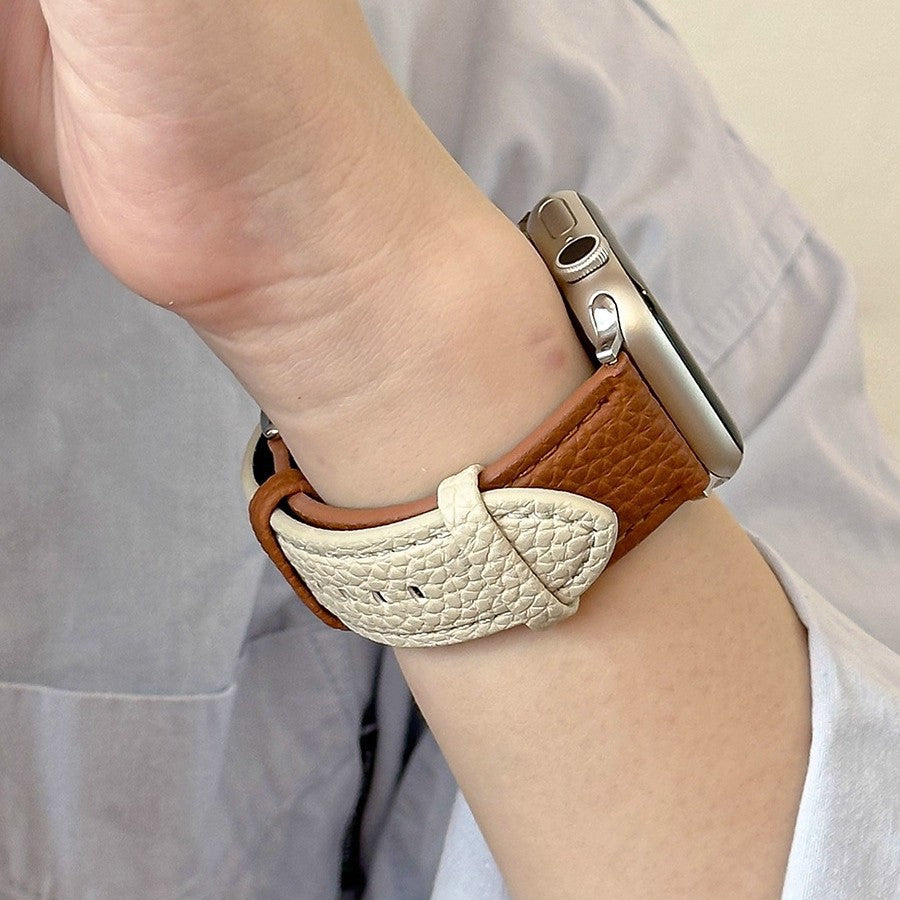 Two-tone pebbled leather smartwatch strap worn on wrist