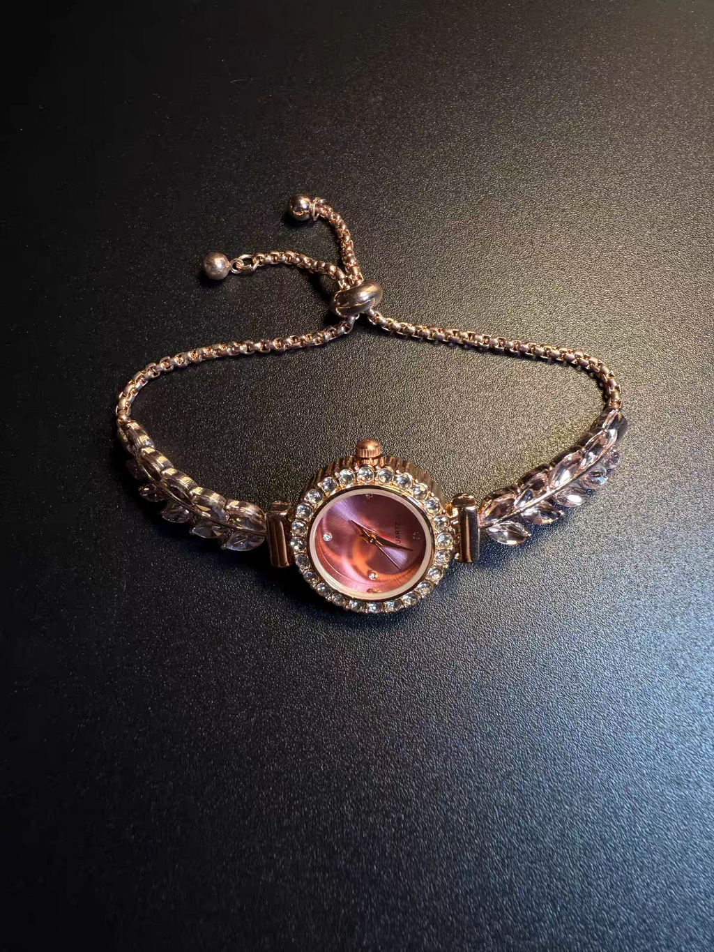 Pink bracelet watch detail