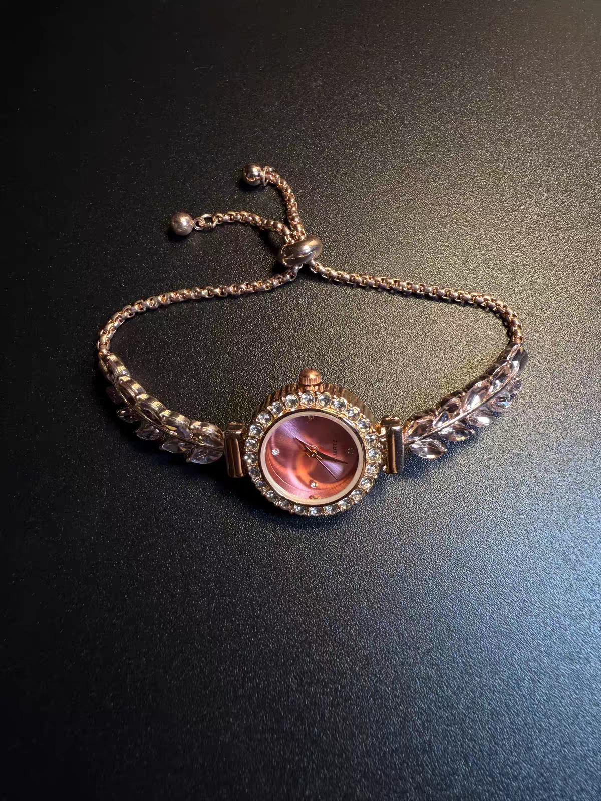 Pink bracelet watch detail
