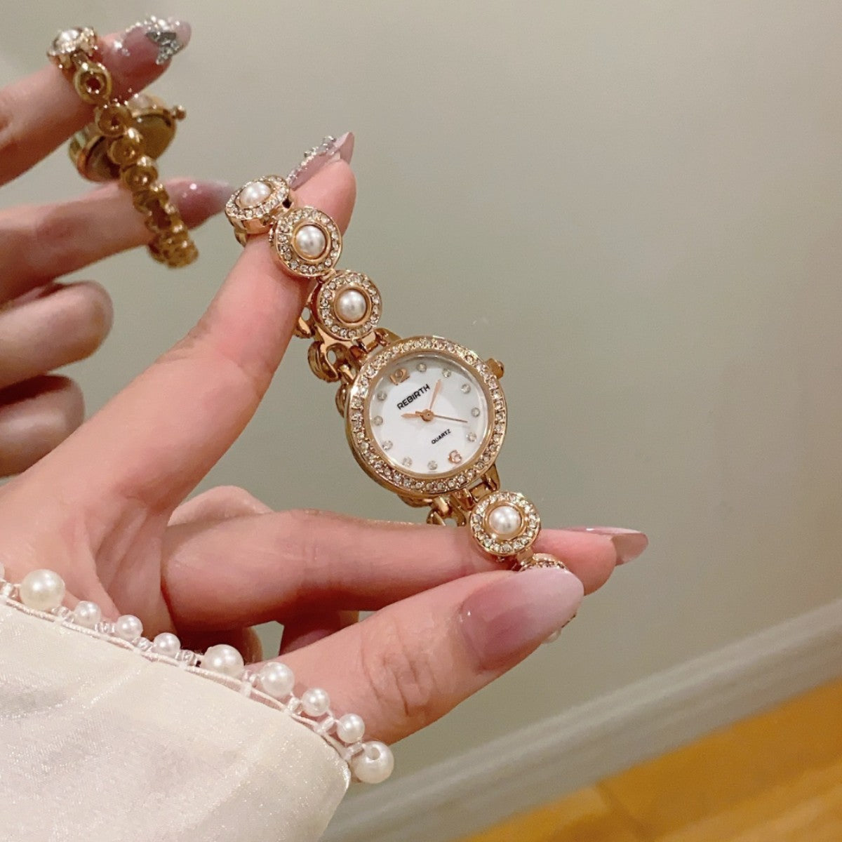 REGIRTH pearl crystal-style round bracelet watch in rose gold tone