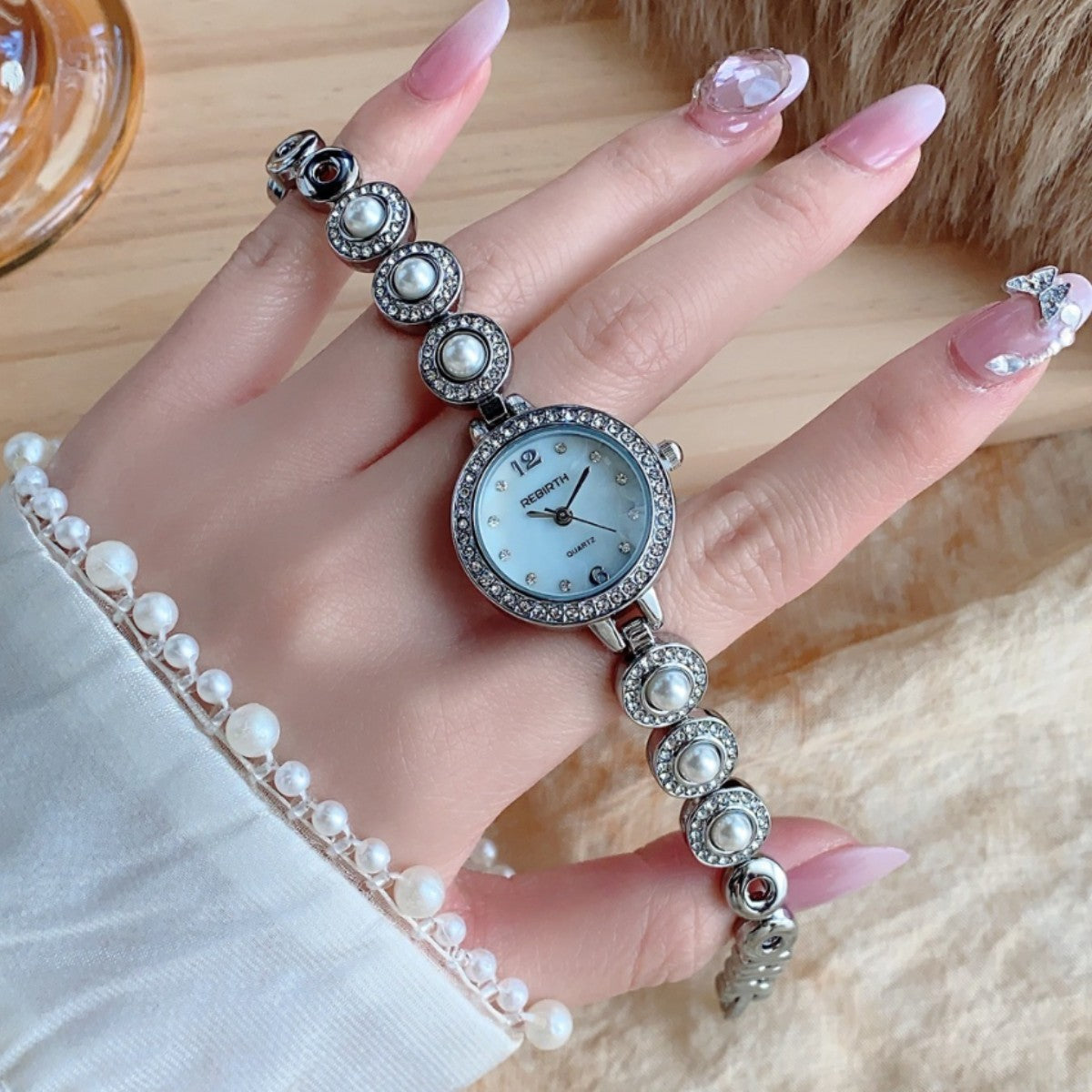 REGIRTH pearl crystal-style round bracelet watch in silver tone