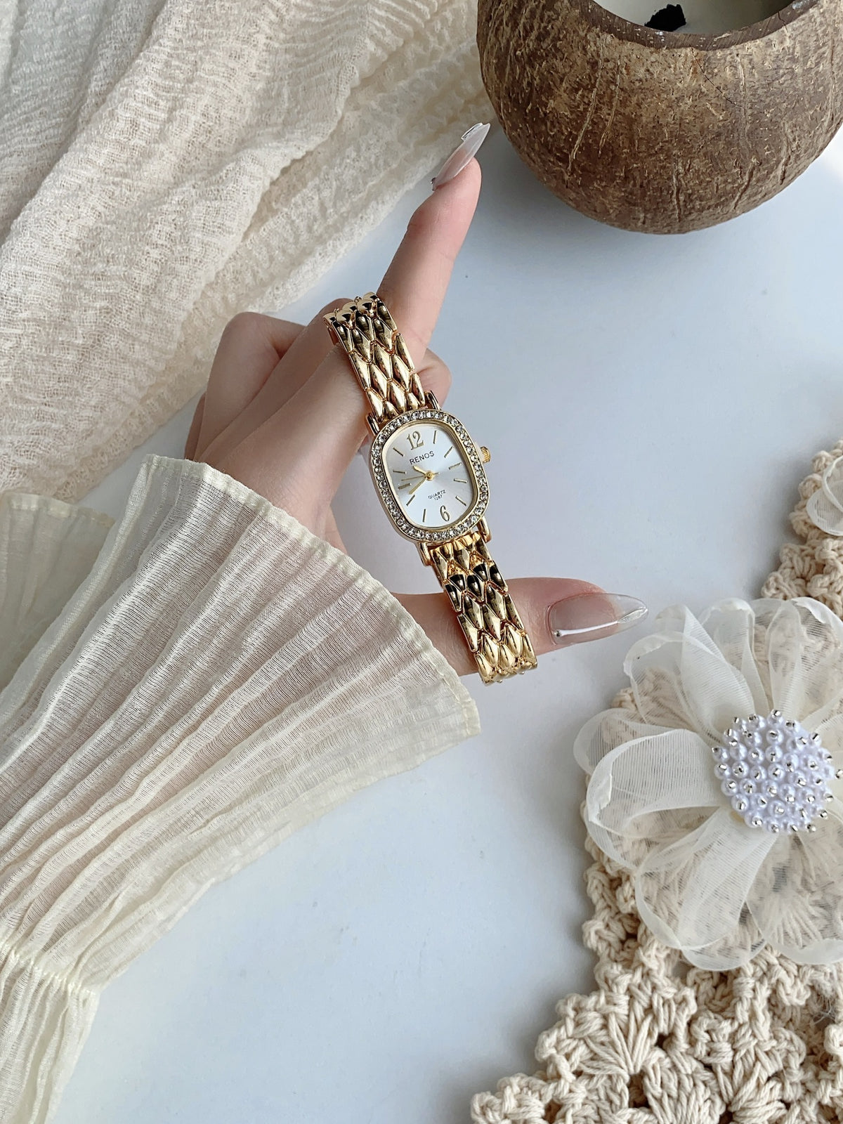 RENOS crystal-style cushion watch in gold tone with silver dial
